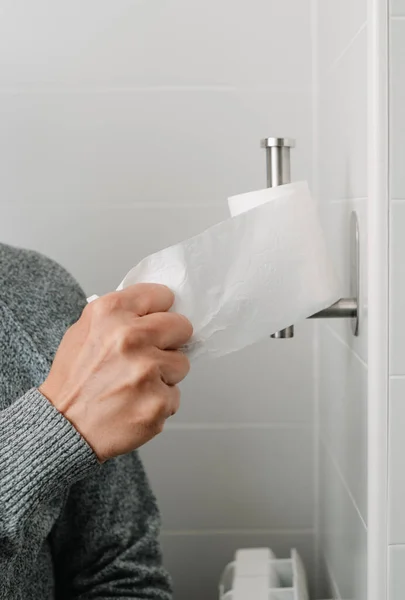 Closeup Man Sitting Toilet Taking Piece Toilet Paper Paper Roll — Stock Photo, Image