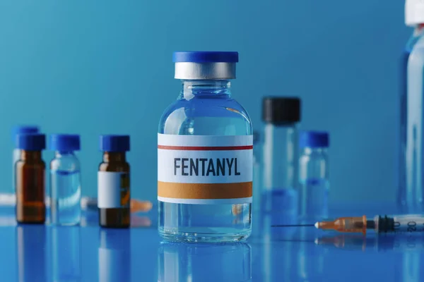 Closeup Simulated Vial Fentanyl Blue Table Next Syringe Some Other — Stock Photo, Image