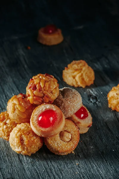 stock image some different panellets, a confection typical of Catalonia, Spain, eaten on All Saints Day, forming a stack on a gray rustic table