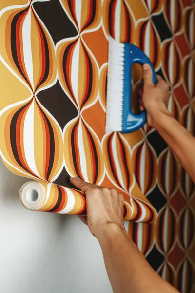 Caucasian Man Uses Blue Brush Attach Geometric Patterned Wallpaper White — Stock Photo, Image