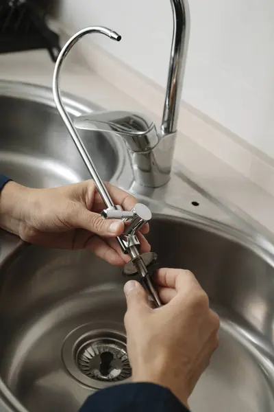 Caucasian Man Blue Overalls Installs Extra Faucet Metal Kitchen Sink — Stock Photo, Image