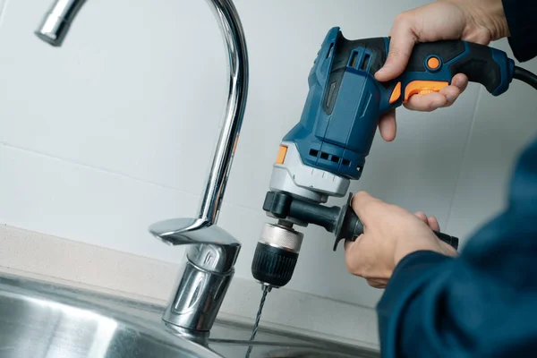 Closeup Man Wearing Blue Overalls Drilling Hole Metal Sink Drill — Stock Photo, Image
