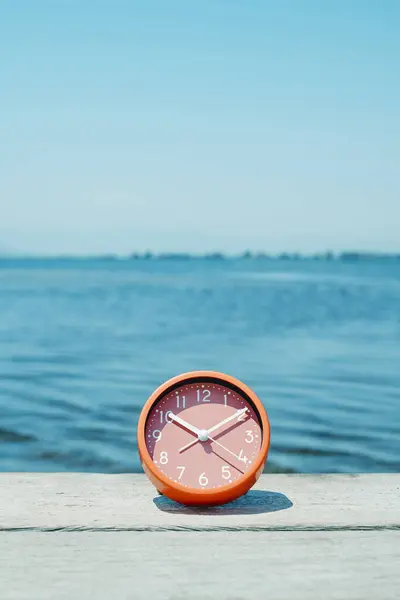Pink Clock Placed Weathered Wooden Pier Next Water Summer Day Εικόνα Αρχείου