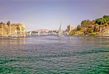 River Nile with ferry boats  in Luxor, Egypt clipart