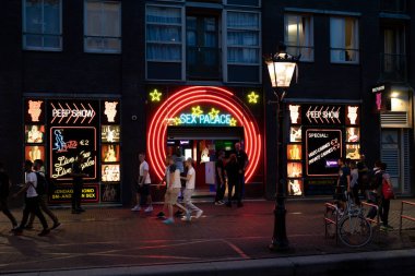 AMSTERDAM, NETHERLANDS - AUGUST 23 2022:  the world famous red district in Amsterdam, Netherlands