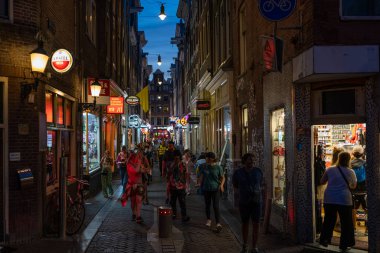 AMSTERDAM, NETHERLANDS - AUGUST 23 2022:  the world famous red district in Amsterdam, Netherlands