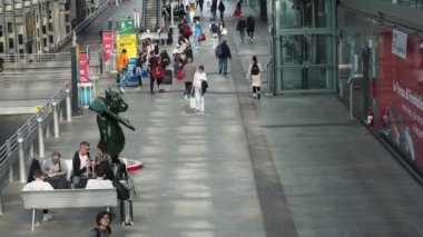 TURIN, ITALY - CIRCA OCTOBER 2022: Travellers at Torino Porta Susa railway station