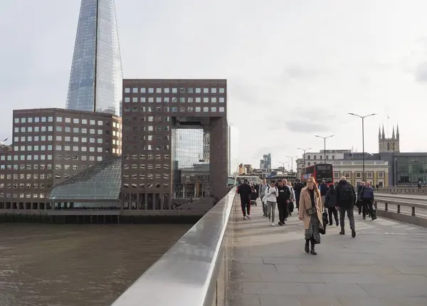 Stock image LONDON, UK - CIRCA OCTOBER 2022: People crossing London Bridge over River Thames