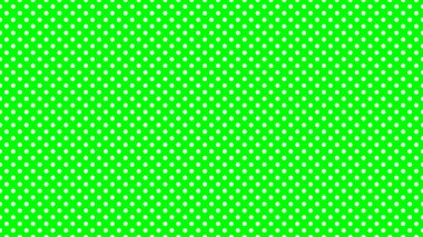 white polka dots pattern over lime useful as a background