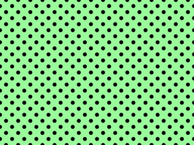 black polka dots pattern over pale green useful as a background