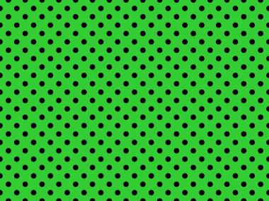 black polka dots pattern over lime green useful as a background