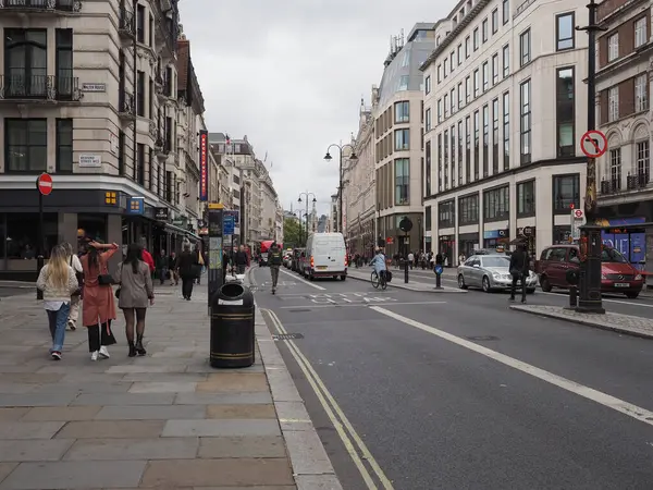 LONDON, UK - CIRCA OCTOBER 2022: People strolling down the Strand