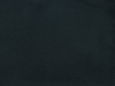 Dark black industrial background texture with speckles of random noise