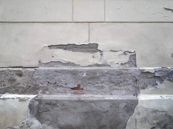 damage caused by dampness and moisture on a wall