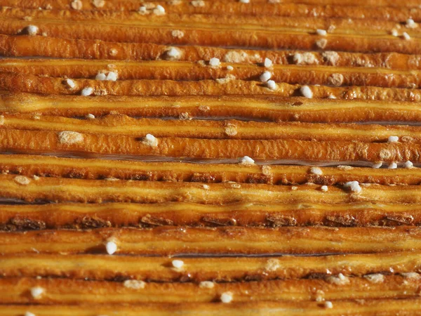 クリスピー焼き塩プレッツェルスナック焼き菓子背景として有用な食品 — ストック写真