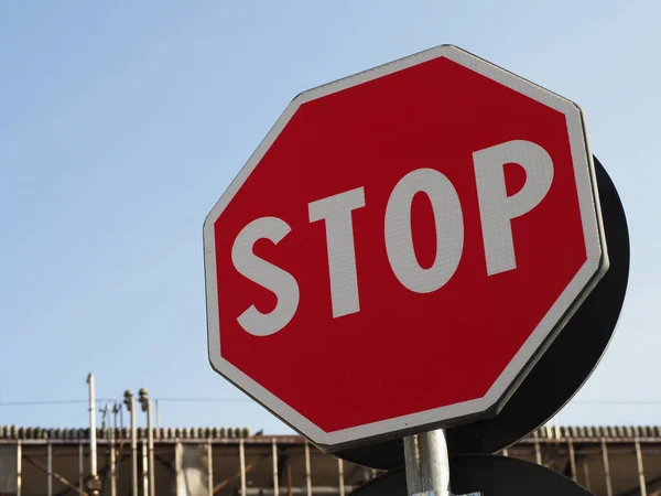 Regulatory signs, stop traffic sign over blurred background