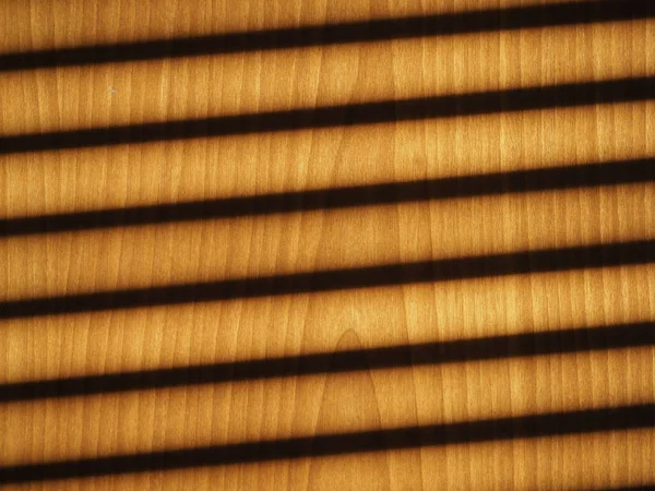 Schatten Von Jalousien Auf Einer Als Hintergrund Nützlichen Holzwand — Stockfoto