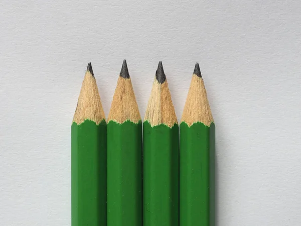 Cuatro Lápices Verdes Hoja Papel Blanco Con Espacio Copia —  Fotos de Stock