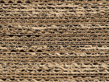 industrial style brown corrugated cardboard texture useful as a background