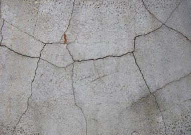 cracked weathered grey concrete texture useful as a background