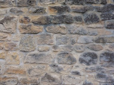 Sanayi tipi kahverengi taş duvar arka plan olarak kullanışlı