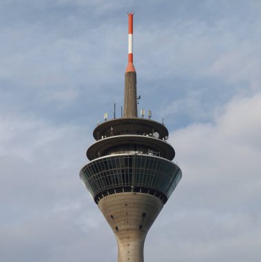 Duesseldorf Rheinturm telecommunications tower over blue sky clipart