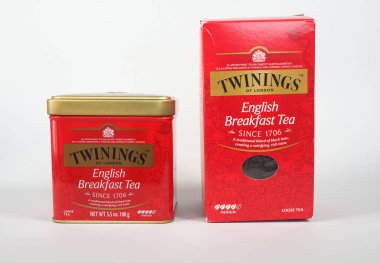 LONDON, UK - NOVEMBER 17, 2024: Can and packet of loose Twinings English breakfast tea clipart