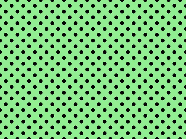 black polka dots pattern over light green useful as a background