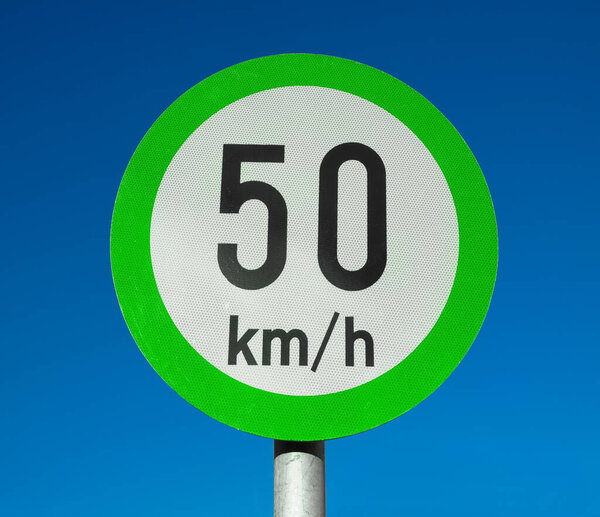 New green bordered speed limit signs indicating advisory speeds not mandatory limits
