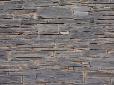 Sanayi tipi gri taş duvar arka plan olarak kullanışlı