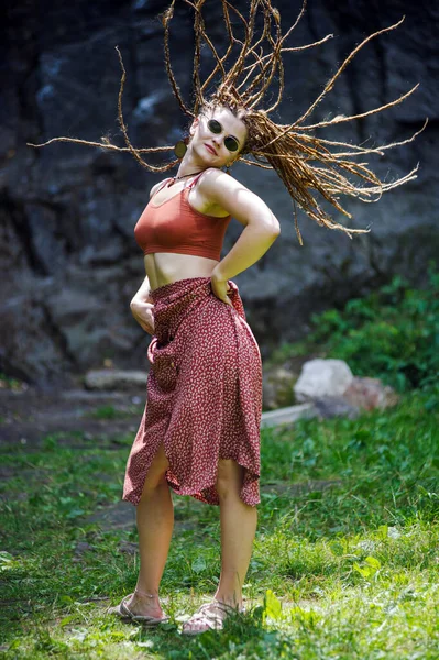 stock image Beautiful girl with dreadlocks, dressed hippie style,poses outdoors.