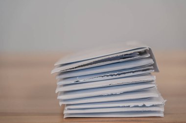 Stack pile of opened envelope documents to read