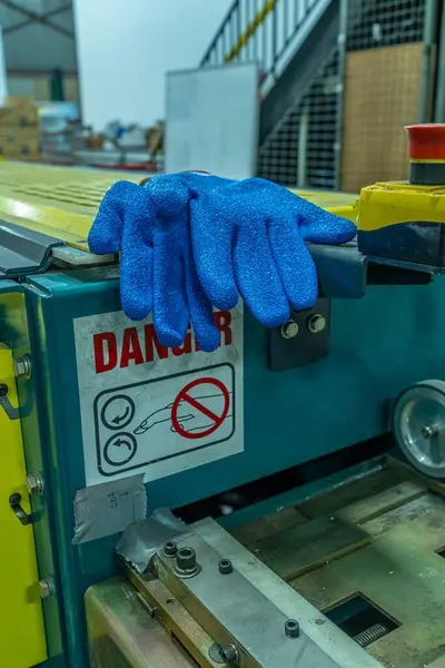 Blue safety protection gloves in factory