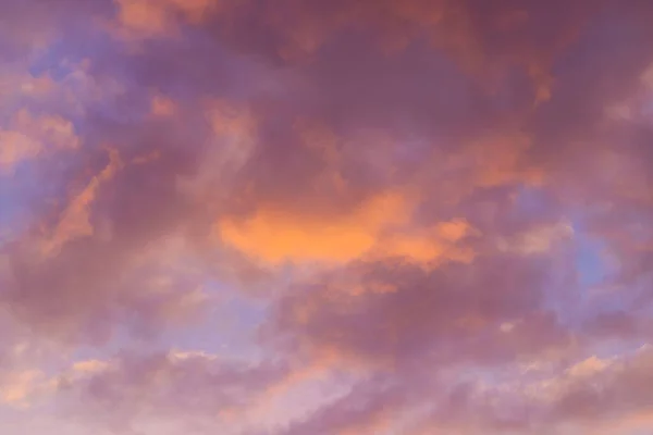 Beautiful sky background. Orange and purple sunset. Texture for you design. Selective focus.