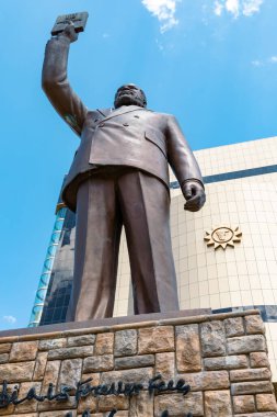 Museum in Windhoek. Sam Nujoma Monument in front of The Independence Memorial Museum  in Windhoek, Namibia. Africa. clipart