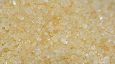 Esmer granüllü şekerin yakın plan çekimleri. Tam kare seçici odak noktası..
