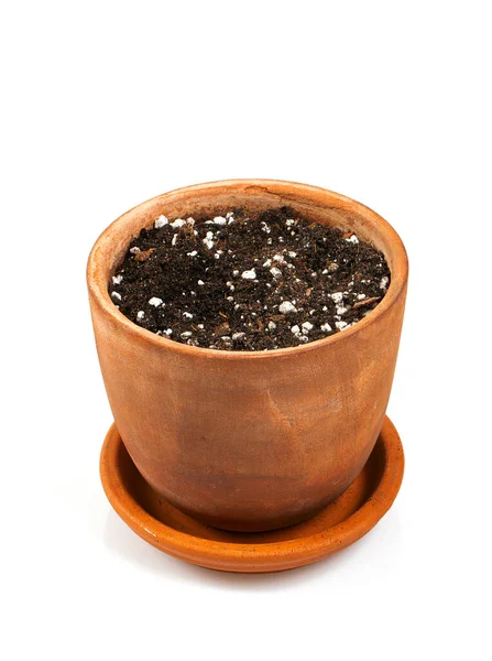 一种古老的陶瓷壶 土壤等待着植物的种植 用白色的背板隔开 — 图库照片