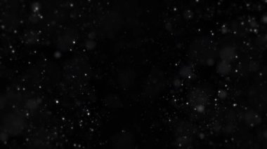 Black background with particles, snowflakes, snowflakes and particles are flying