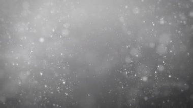 Gray background with particles, snowflakes, snowflakes and particles are flying