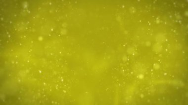 Yellow background with particles, snowflakes, snowflakes and particles are flying