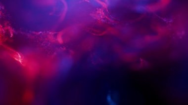 Parçacıkları ve grafikleri olan neon kırmızı arkaplan