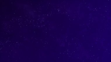 Mavi arkaplan üzerinde beyaz parçacıkların hareketine sahip arkaplan, parçacıklar ve bokeh