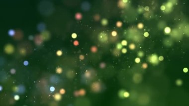 Bokeh ile yeşil arkaplan ve farklı renkteki parçacıklar, güzel bokeh