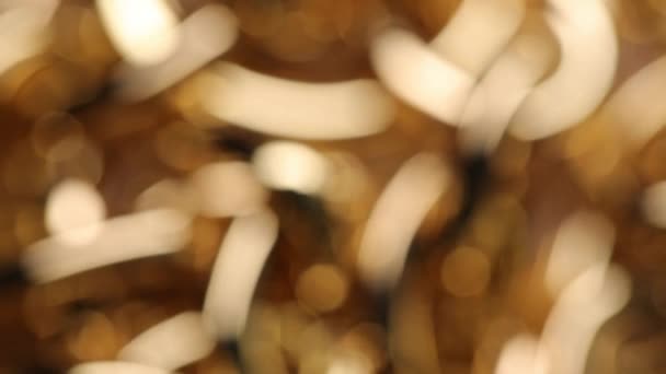 Beautiful golden bokeh, background with blur in gold color, New Years background.