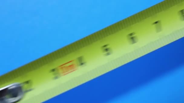 Man Measures Tape Measure Blue Background — Stock Video