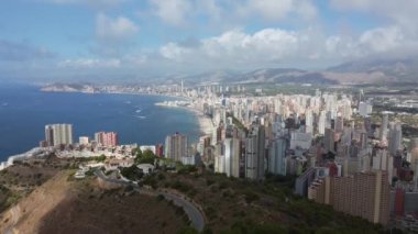 beautiful aerial view of Benidorm and cross La Cruz De Benidorm in Spain