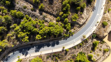 travel and transportation concept - aerial view of beautiful mountain road