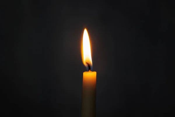 Close Burning Yellow Candle Dark Background Copy Space — Stock Photo, Image