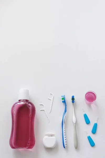 Flatlay Dental Floss Toothbrushes Toothpicks Rinse White Background Copyspace — Stock Photo, Image