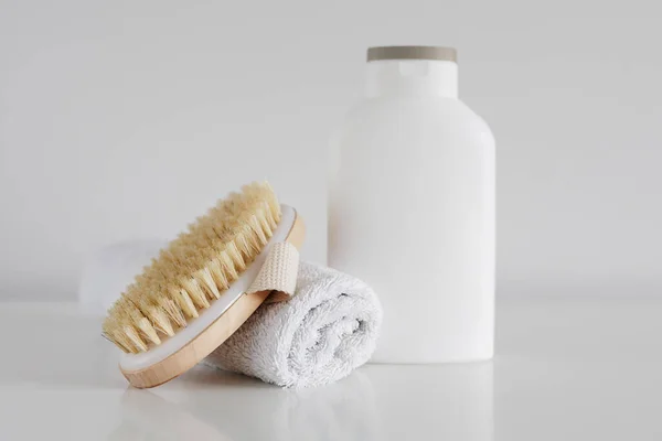 Towel Cream Bottle Massage Brush White Table — Stock Photo, Image